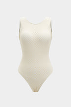 A fitted black one-piece swimsuit made from a smooth polyamide blend with a modern finish. 2