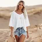 Clara oversized short sleeve V-neck shirt in light blue, made from a soft cotton-polyester blend. 0