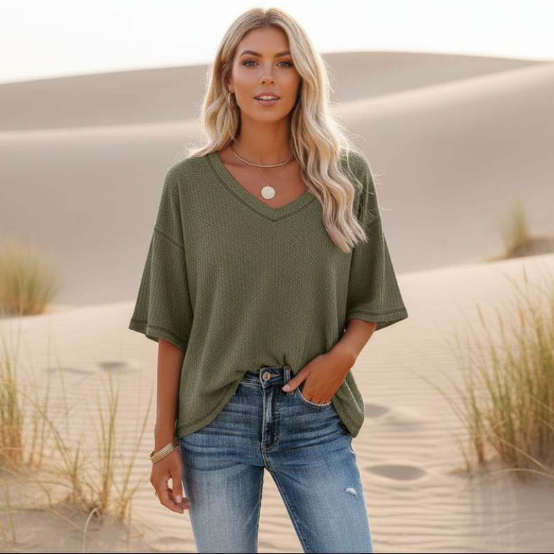 Clara oversized short sleeve V-neck shirt in light blue, made from a soft cotton-polyester blend. 2