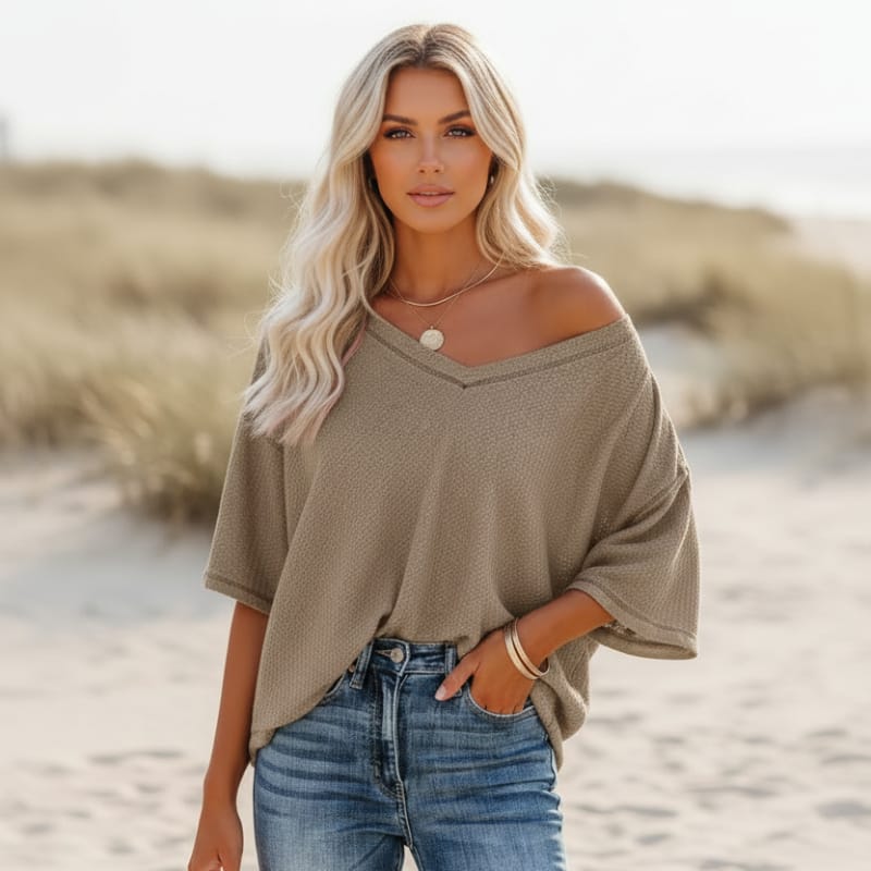 Clara oversized short sleeve V-neck shirt in light blue, made from a soft cotton-polyester blend. 3