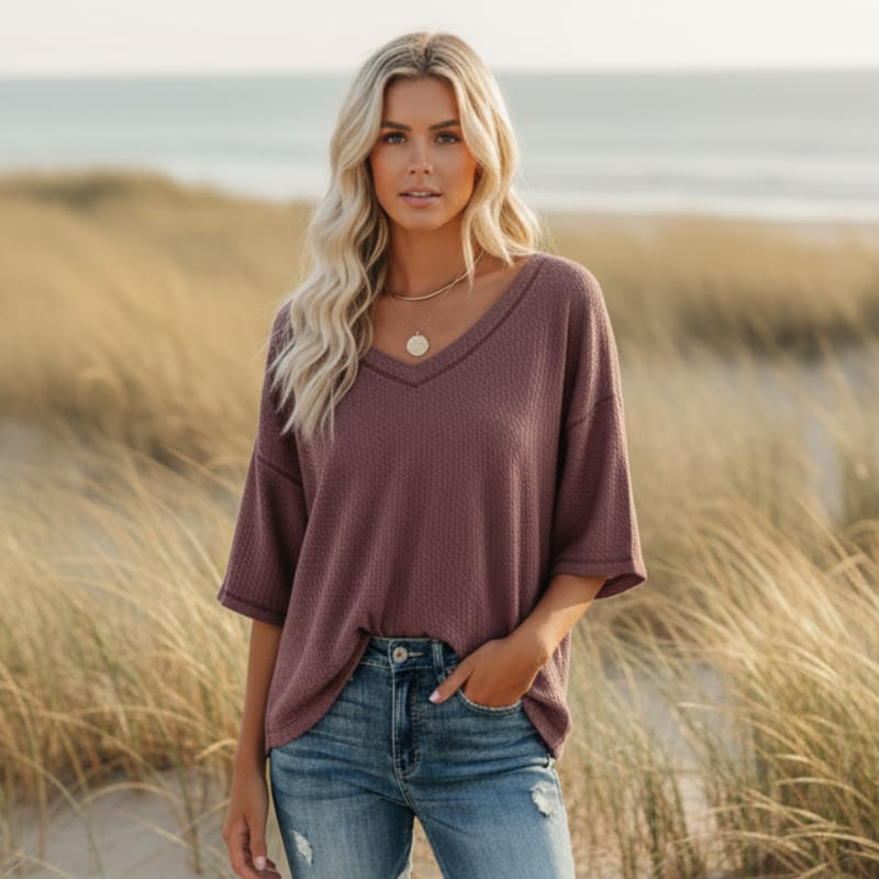 Clara oversized short sleeve V-neck shirt in light blue, made from a soft cotton-polyester blend. 4