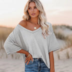 Clara oversized short sleeve V-neck shirt in light blue, made from a soft cotton-polyester blend. 6