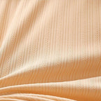 Plus size bra in soft blush pink, featuring adjustable straps and a non-wired, comfortable design. 6