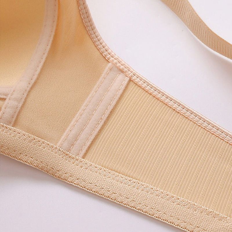 Plus size bra in soft blush pink, featuring adjustable straps and a non-wired, comfortable design. 7