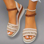 Lightweight women's sandals in soft beige with a casual, step-in style, perfect for summer outings. 0
