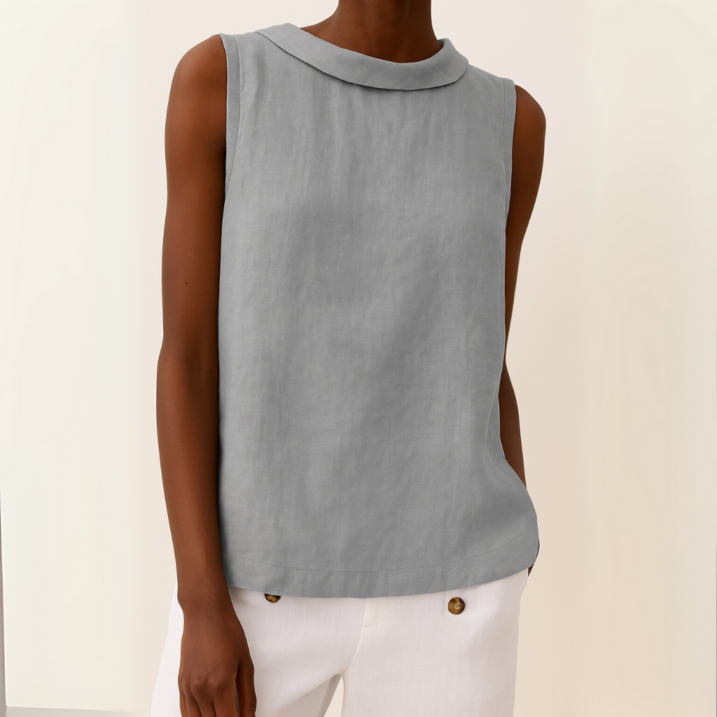 Light blue sleeveless linen cotton blend top with a pleated collar, featuring a relaxed and casual style. 0