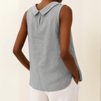 Light blue sleeveless linen cotton blend top with a pleated collar, featuring a relaxed and casual style. 1
