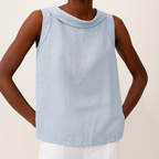 Light blue sleeveless linen cotton blend top with a pleated collar, featuring a relaxed and casual style. 4