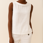 Light blue sleeveless linen cotton blend top with a pleated collar, featuring a relaxed and casual style. 5