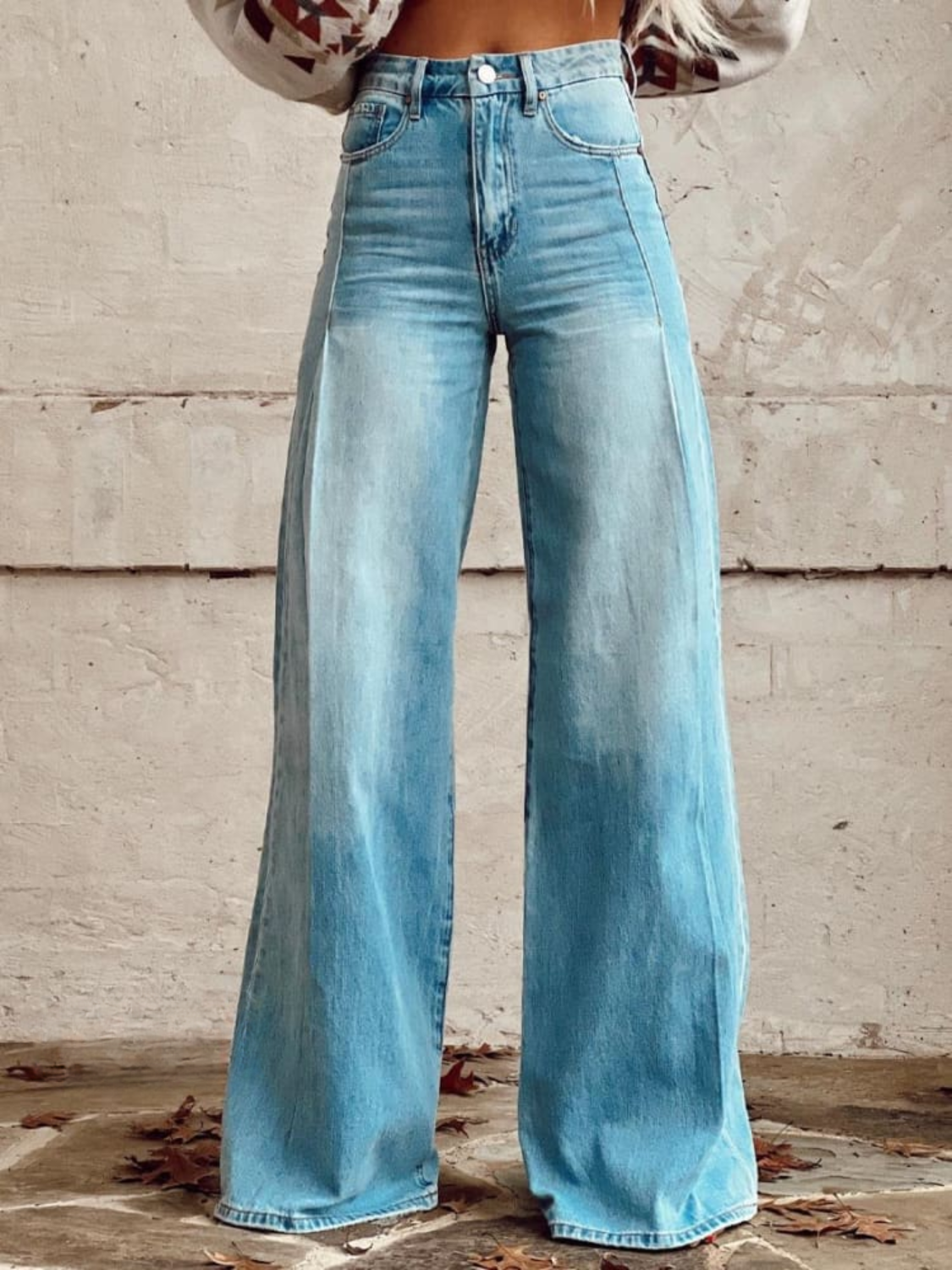 High-waisted, loose-fit wide leg pants in a soft beige, offering a relaxed and effortless look. 1