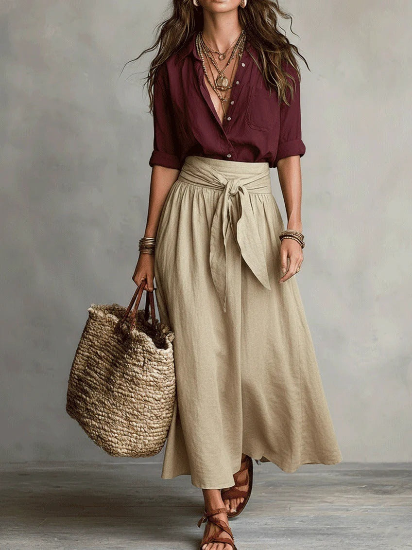 Soft beige two-piece midi set in a relaxed style, featuring a tie-waist sash for an effortless look. 1