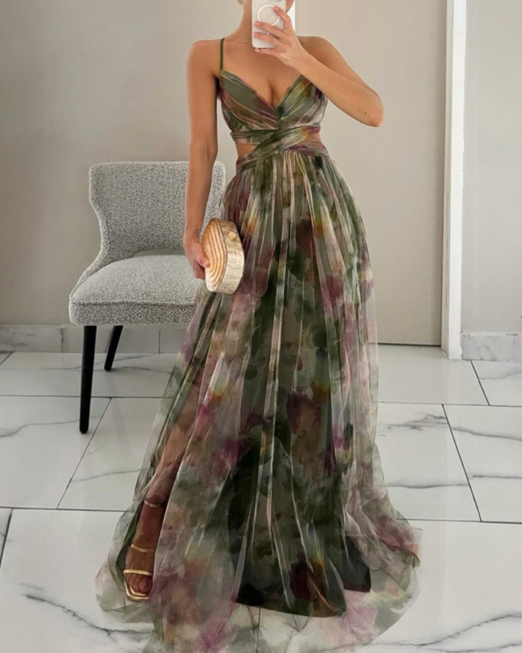 Floral print maxi dress in soft pastels, featuring adjustable straps and a flowing silhouette. 3