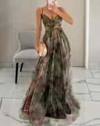 Floral print maxi dress in soft pastels, featuring adjustable straps and a flowing silhouette. 3