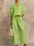 Light blue two-piece lounge outfit featuring a relaxed fit and soft fabric, perfect for comfort and leisure. 0
