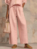 Light blue two-piece lounge outfit featuring a relaxed fit and soft fabric, perfect for comfort and leisure. 2