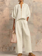 Light blue two-piece lounge outfit featuring a relaxed fit and soft fabric, perfect for comfort and leisure. 3