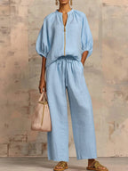 Light blue two-piece lounge outfit featuring a relaxed fit and soft fabric, perfect for comfort and leisure. 5