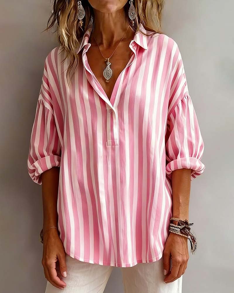 Light blue striped blouse with a relaxed fit and short sleeves. 0