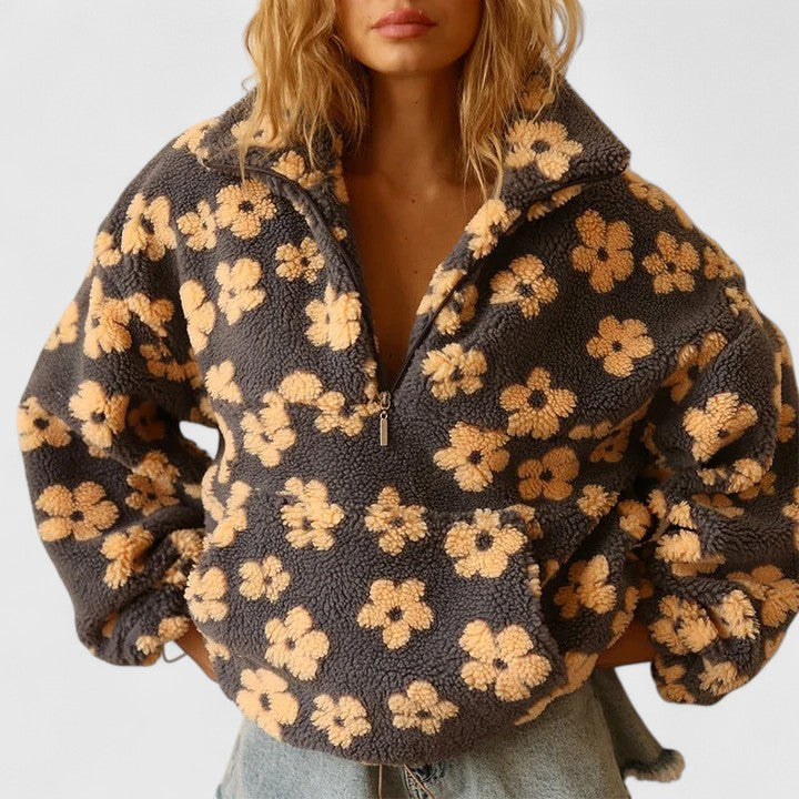 Teddy fleece half-zip pullover for women with a raised floral pattern.