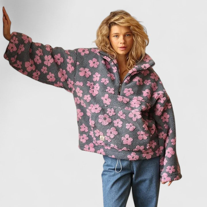 Teddy fleece half-zip pullover for women with a raised floral pattern.