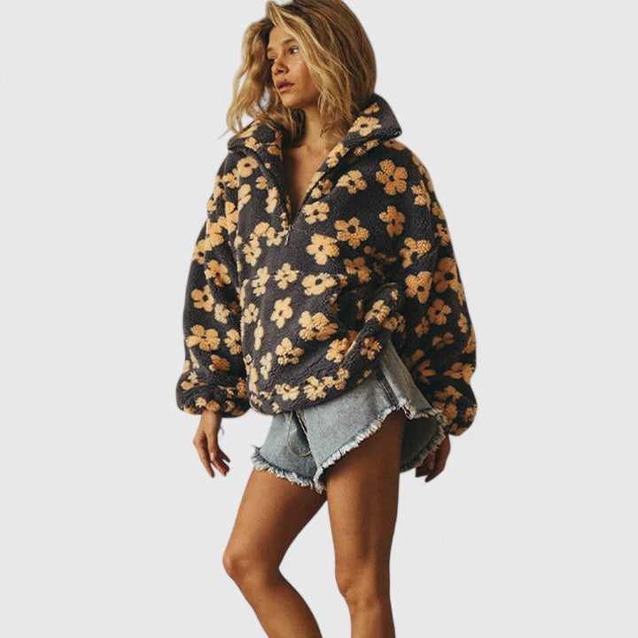 Teddy fleece half-zip pullover for women with a raised floral pattern.