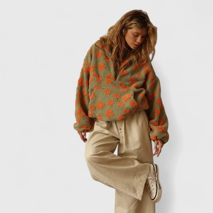 Teddy fleece half-zip pullover for women with a raised floral pattern.