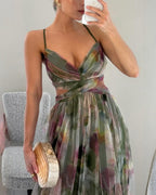Floral print maxi dress in soft pastels, featuring adjustable straps and a flowing silhouette. 4