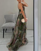 Floral print maxi dress in soft pastels, featuring adjustable straps and a flowing silhouette. 5