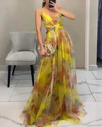 Floral print maxi dress in soft pastels, featuring adjustable straps and a flowing silhouette. 6