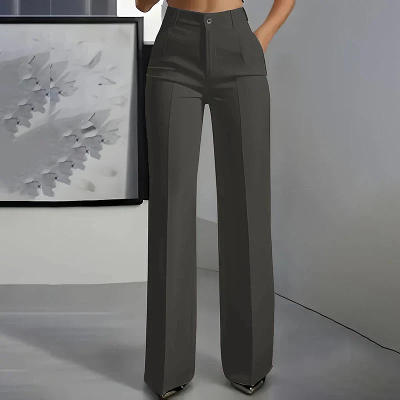 High-waisted pants in dusty rose with a chic, tailored style. 1