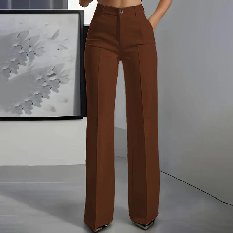 High-waisted pants in dusty rose with a chic, tailored style. 11