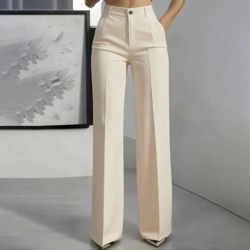 High-waisted pants in dusty rose with a chic, tailored style. 3