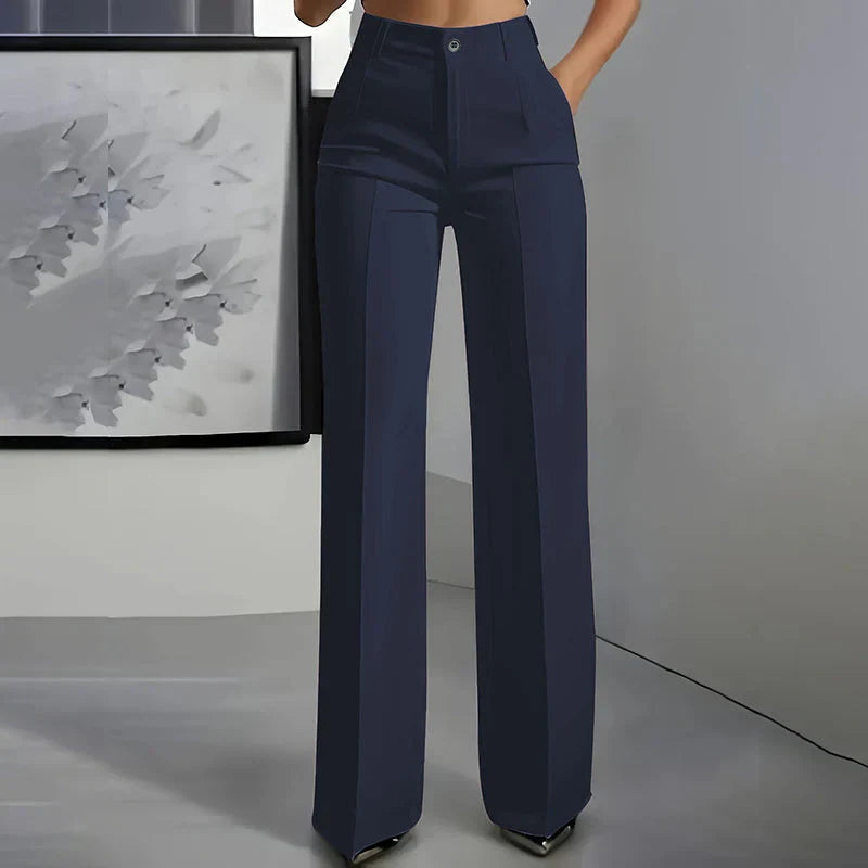 High-waisted pants in dusty rose with a chic, tailored style. 9