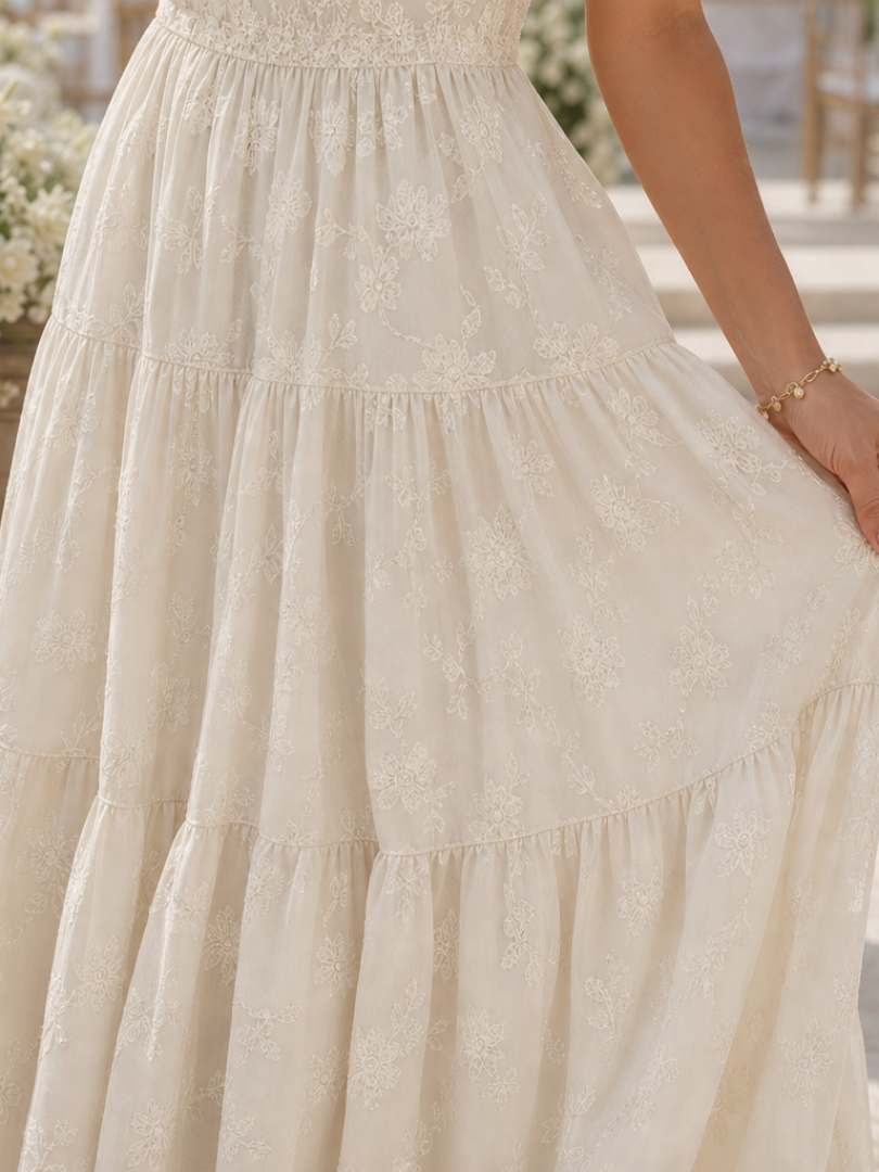 Elaria short sleeve midi dress in soft pink with a floral pattern and textured fabric for a casual, feminine look. 2