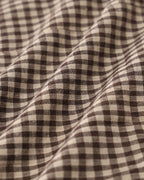 Brown plaid cotton vest with a single-breasted design and round neck. Casual style suitable for layering. 5