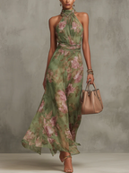 Eliza floral summer dress in pastel pink, featuring a halter neckline and a defined waist for a feminine silhouette. 0