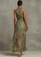 Eliza floral summer dress in pastel pink, featuring a halter neckline and a defined waist for a feminine silhouette. 1