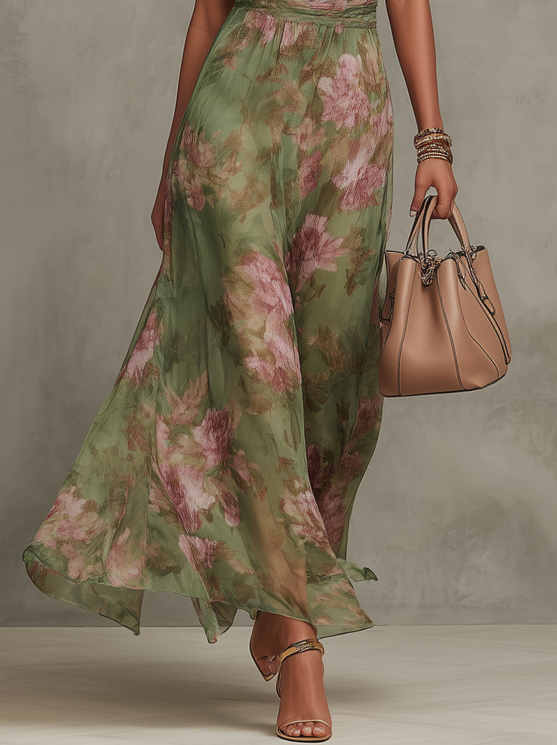 Eliza floral summer dress in pastel pink, featuring a halter neckline and a defined waist for a feminine silhouette. 3