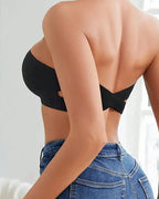 Black seamless bandeau bralette with crisscross side closure, offering a modern and minimalist style. 5