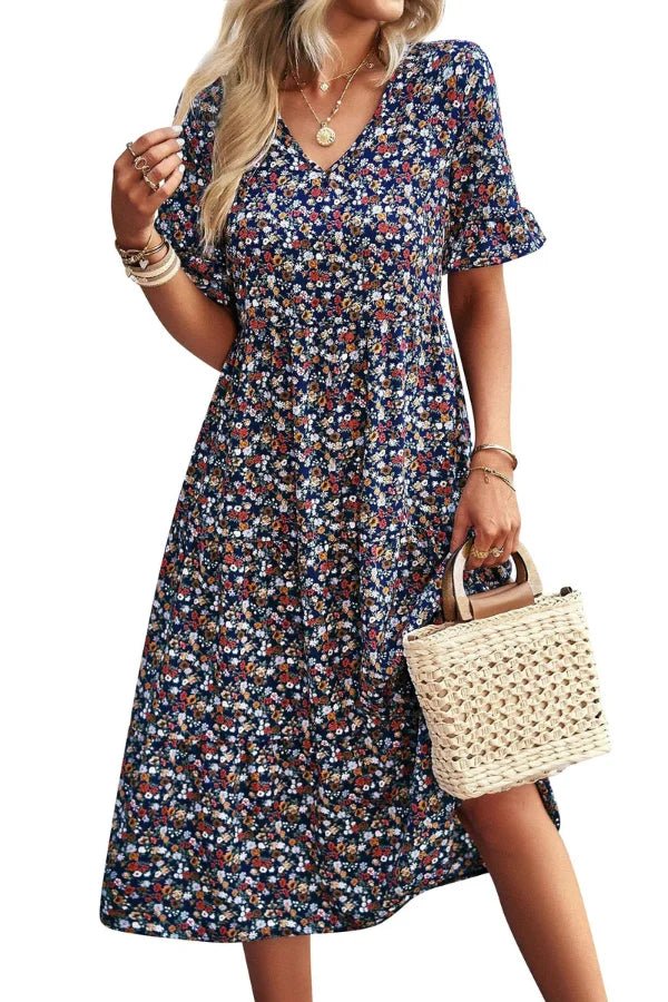 Light blue floral summer dress with a flowing, relaxed fit and delicate straps. Perfect for warm-weather outings. 0
