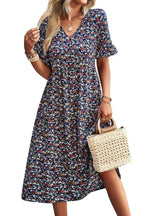Light blue floral summer dress with a flowing, relaxed fit and delicate straps. Perfect for warm-weather outings. 0