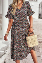Light blue floral summer dress with a flowing, relaxed fit and delicate straps. Perfect for warm-weather outings. 1