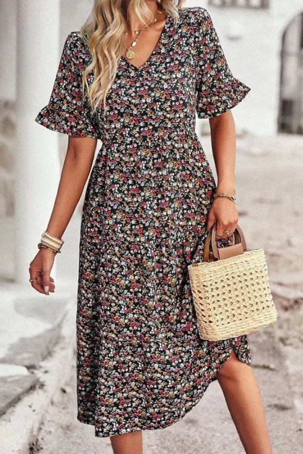 Light blue floral summer dress with a flowing, relaxed fit and delicate straps. Perfect for warm-weather outings. 1