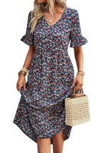 Light blue floral summer dress with a flowing, relaxed fit and delicate straps. Perfect for warm-weather outings. 3