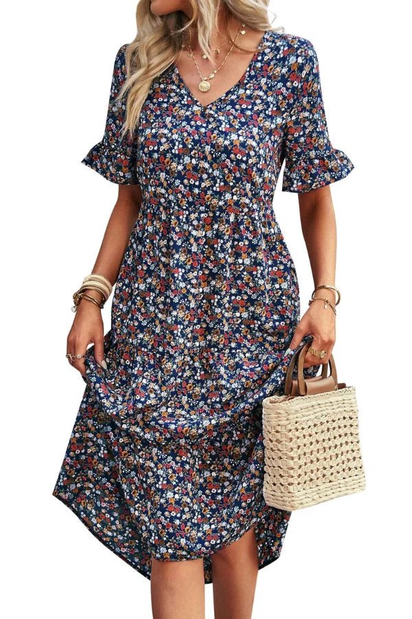 Light blue floral summer dress with a flowing, relaxed fit and delicate straps. Perfect for warm-weather outings. 3