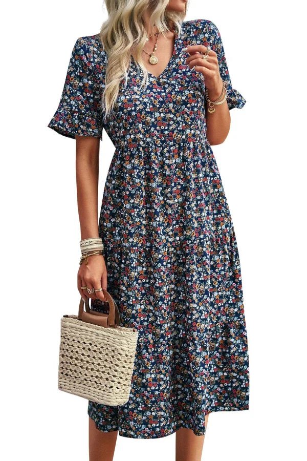 Light blue floral summer dress with a flowing, relaxed fit and delicate straps. Perfect for warm-weather outings. 4