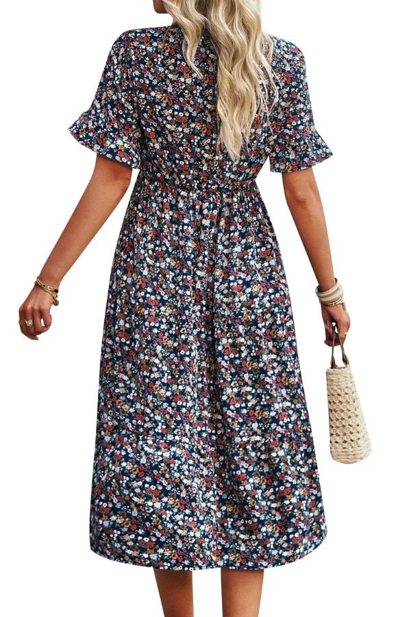 Light blue floral summer dress with a flowing, relaxed fit and delicate straps. Perfect for warm-weather outings. 5