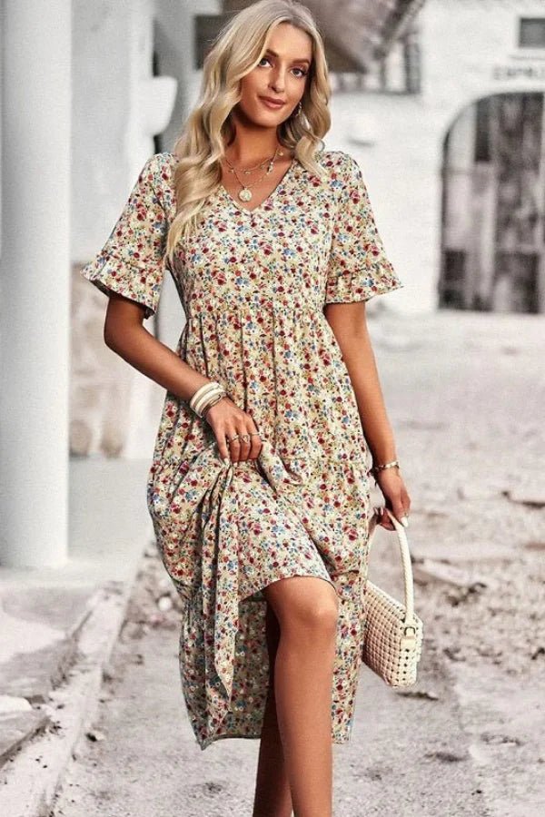Light blue floral summer dress with a flowing, relaxed fit and delicate straps. Perfect for warm-weather outings. 7