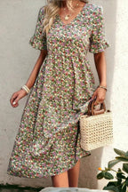 Light blue floral summer dress with a flowing, relaxed fit and delicate straps. Perfect for warm-weather outings. 8