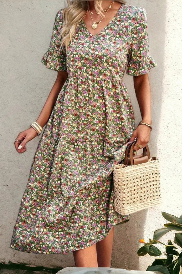 Light blue floral summer dress with a flowing, relaxed fit and delicate straps. Perfect for warm-weather outings. 8